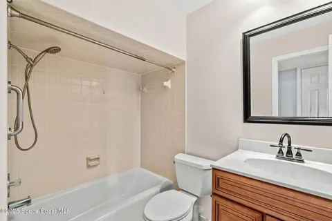 a view of entryway with wooden floor and stairs