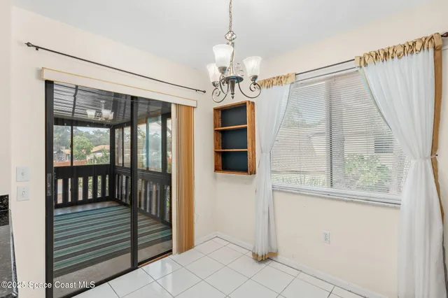a view of a hallway with windows