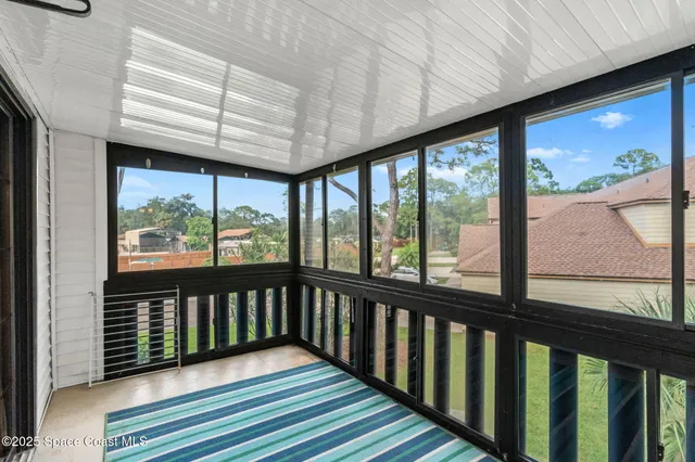 a view of a porch with wooden floor