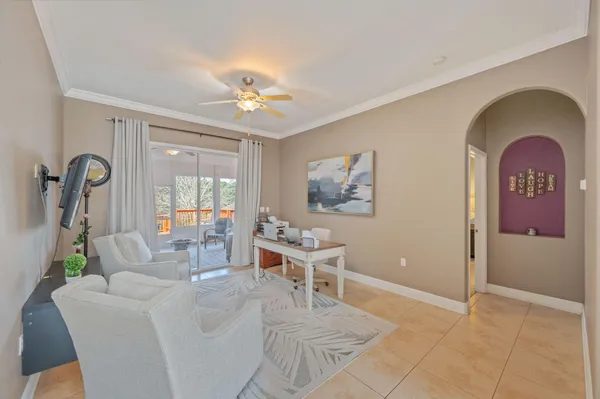 a view of a livingroom with furniture window and wooden floor