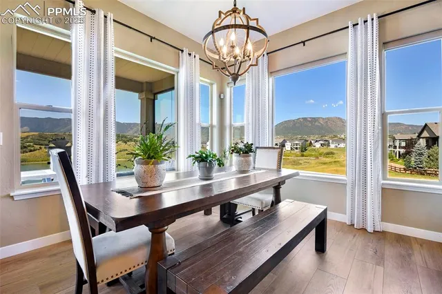 a view of a dining room with furniture window and wooden floor
