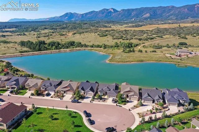 an aerial view of a house with a lake view