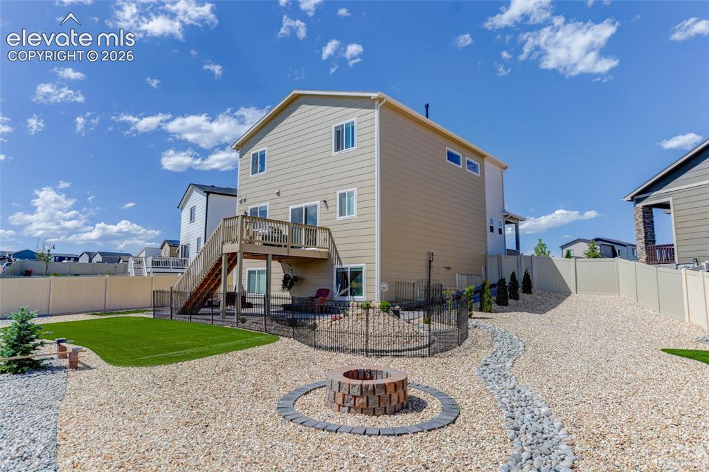 9734 Hidden Ranch Court Peyton, CO 80831 - Photo 26 of 29 Fully fenced yard with firepit