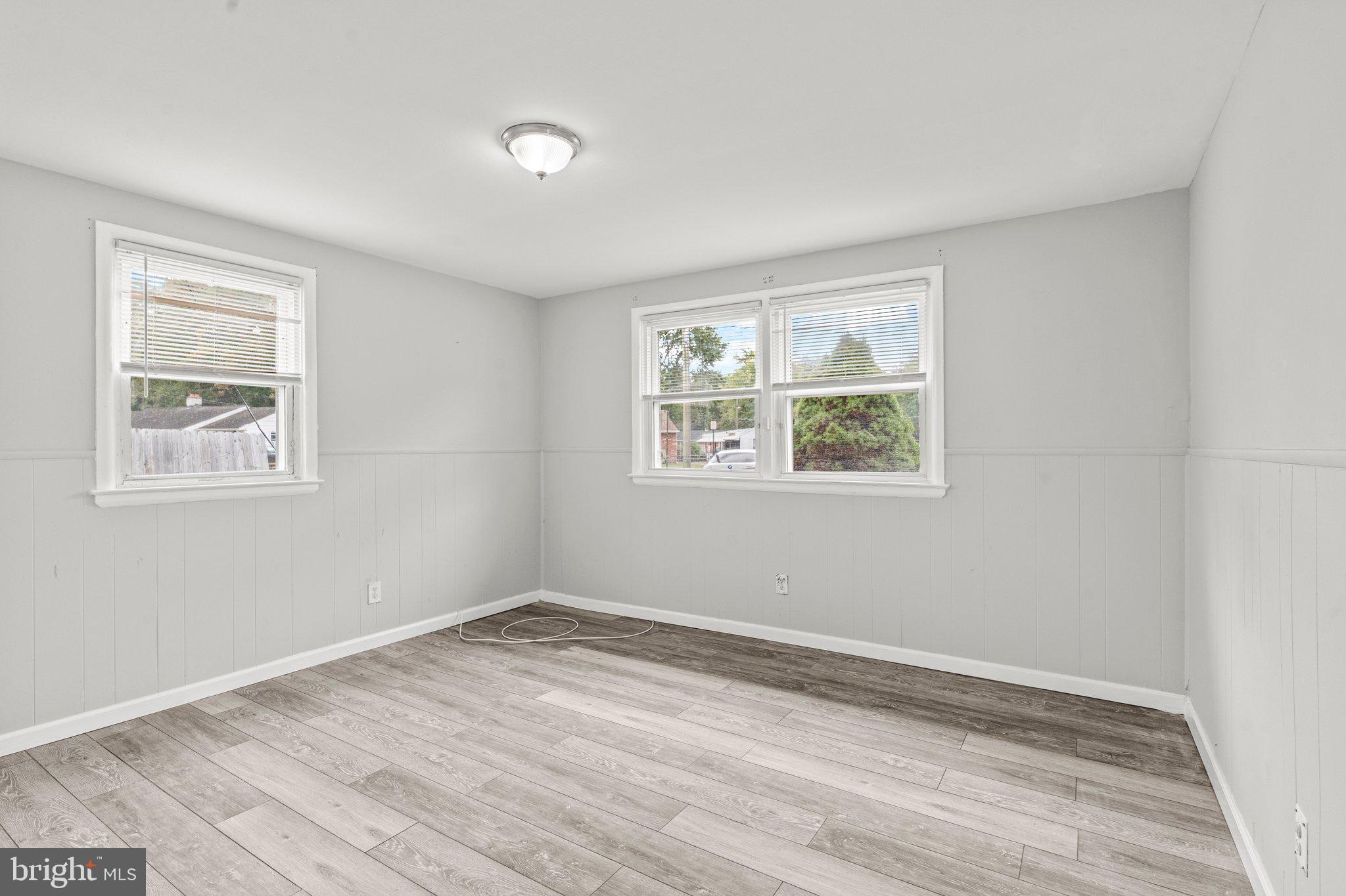 176 Lemmon Avenue Pemberton, NJ 08068 - Photo 13 of 20 a view of empty room with window and wooden floor