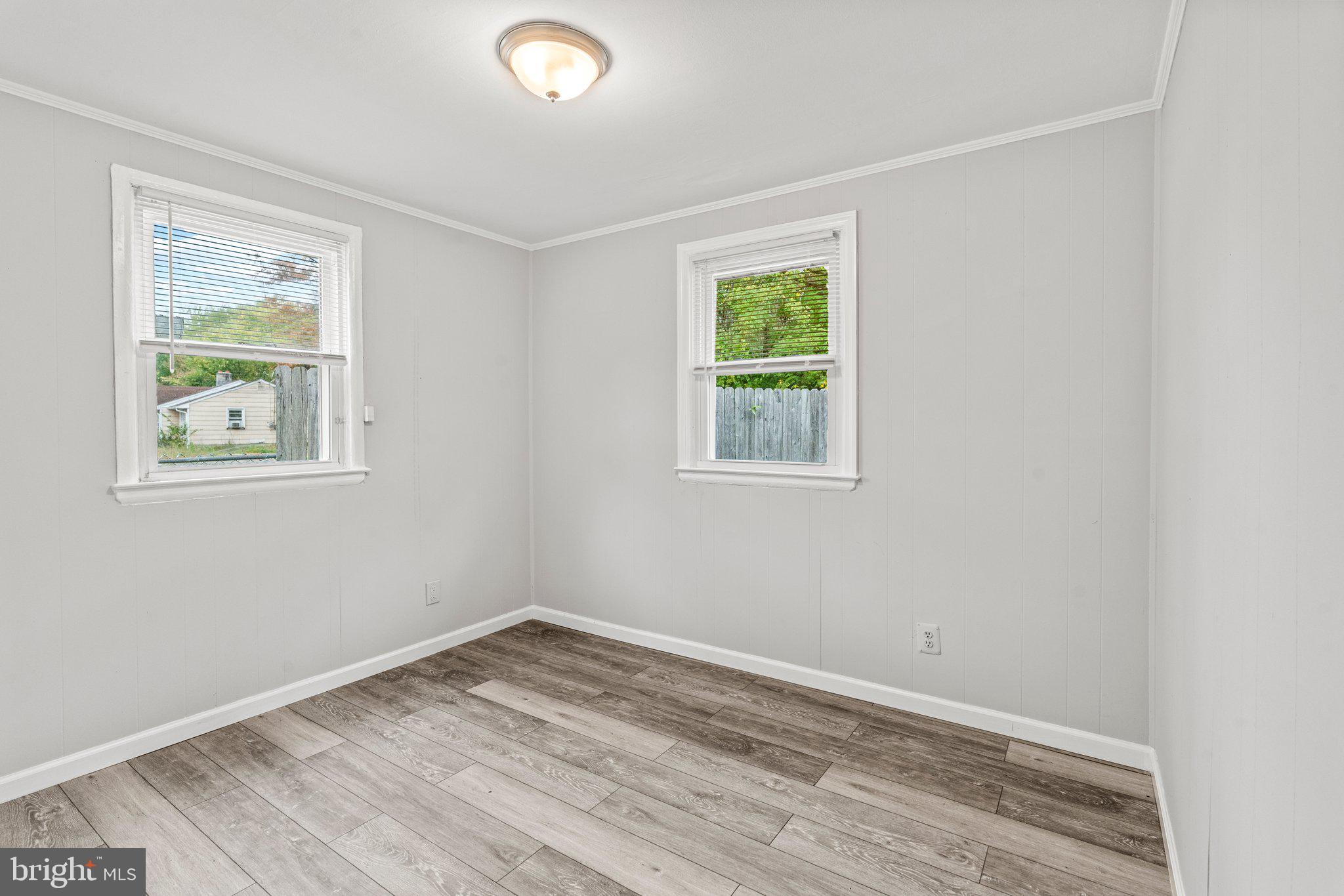 176 Lemmon Avenue Pemberton, NJ 08068 - Photo 17 of 20 wooden floor in an empty room with a window