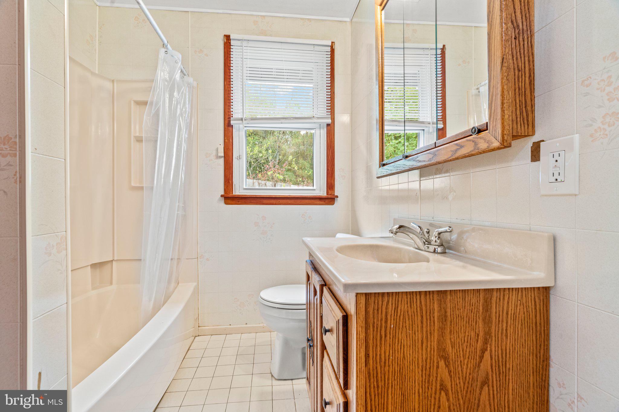176 Lemmon Avenue Pemberton, NJ 08068 - Photo 18 of 20 a bathroom with a granite countertop sink toilet and mirror