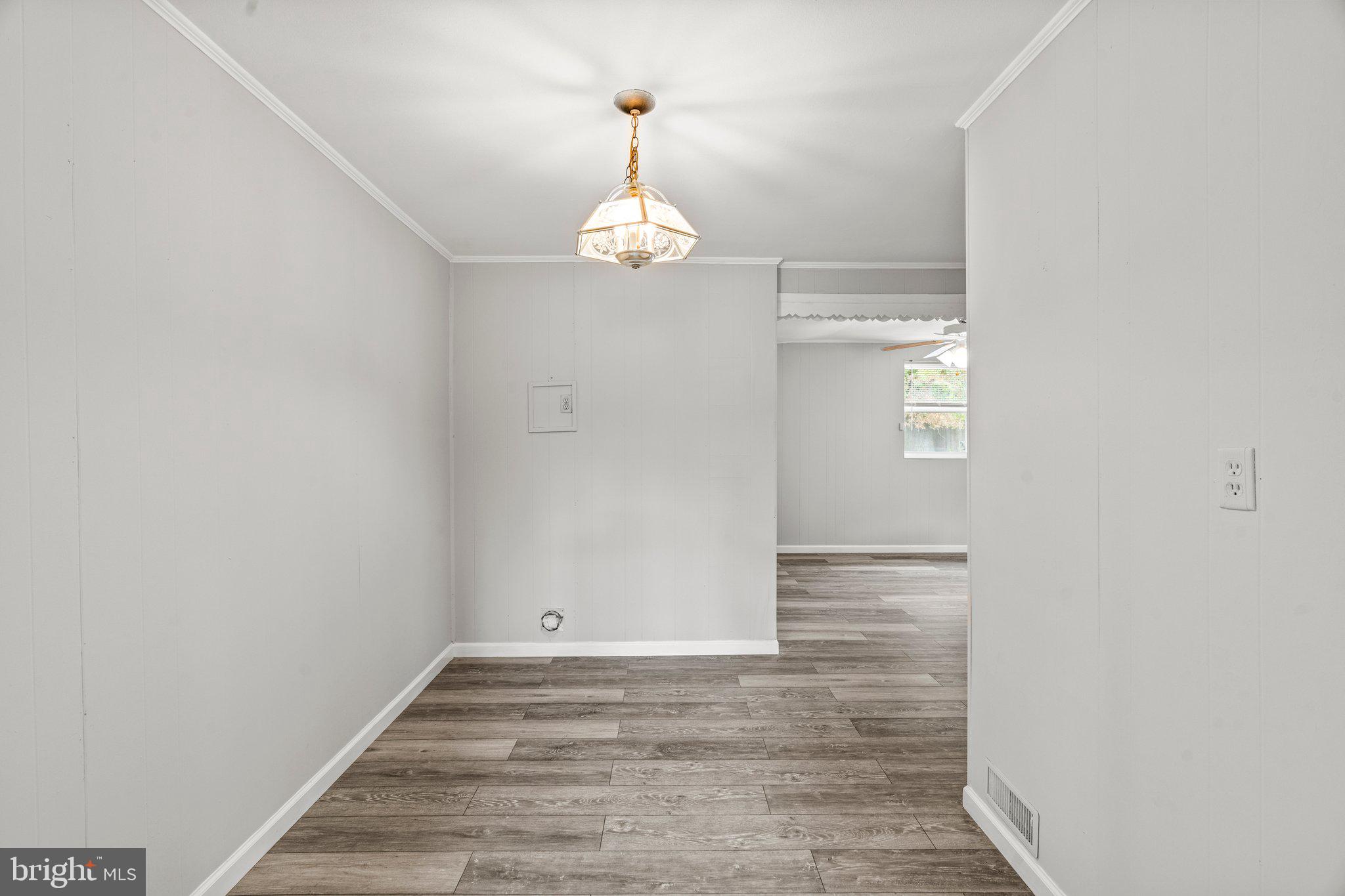 176 Lemmon Avenue Pemberton, NJ 08068 - Photo 7 of 20 a view of empty room with wooden floor and fan