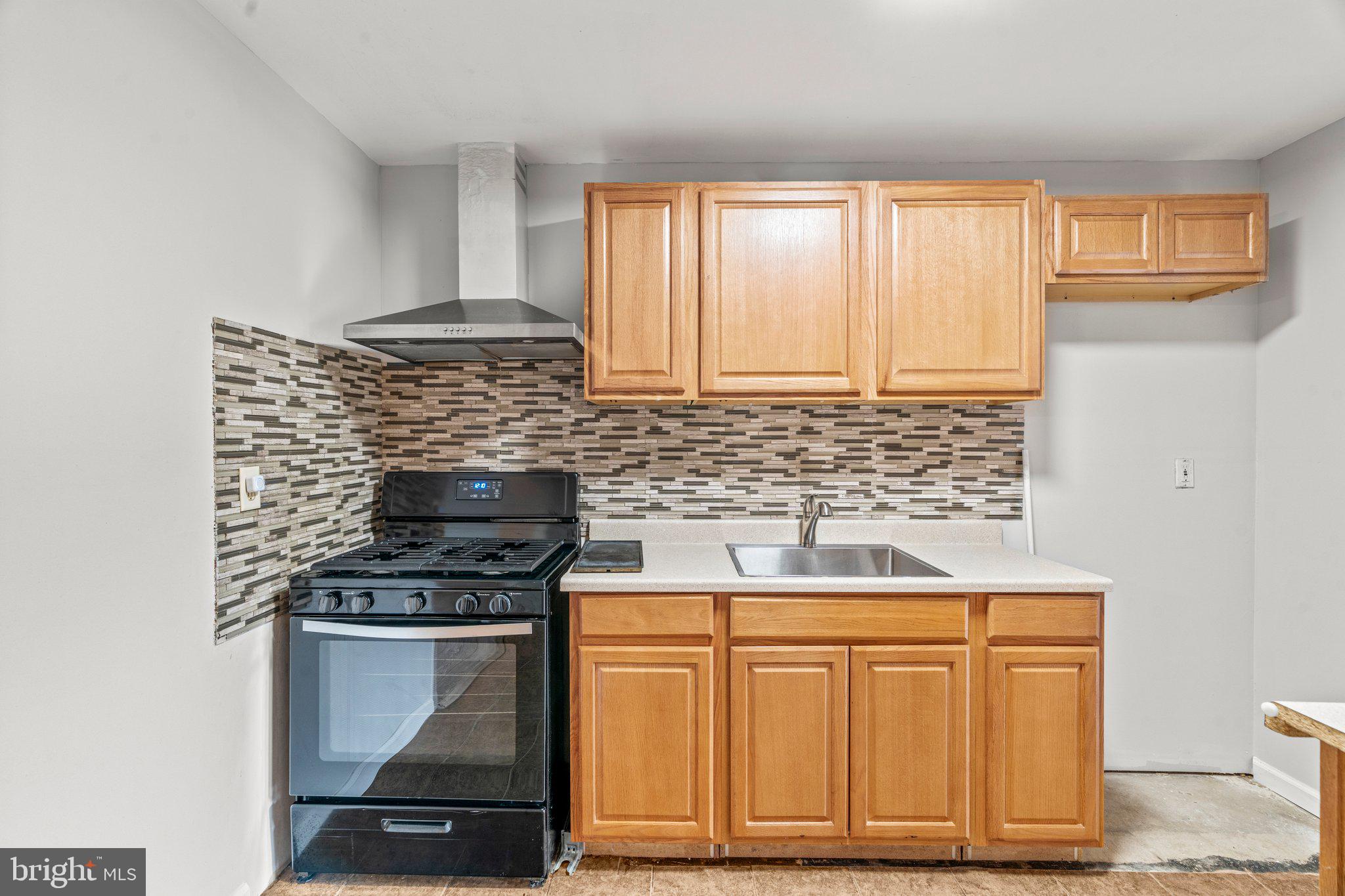 176 Lemmon Avenue Pemberton, NJ 08068 - Photo 10 of 20 a kitchen with granite countertop cabinets stainless steel appliances and a window