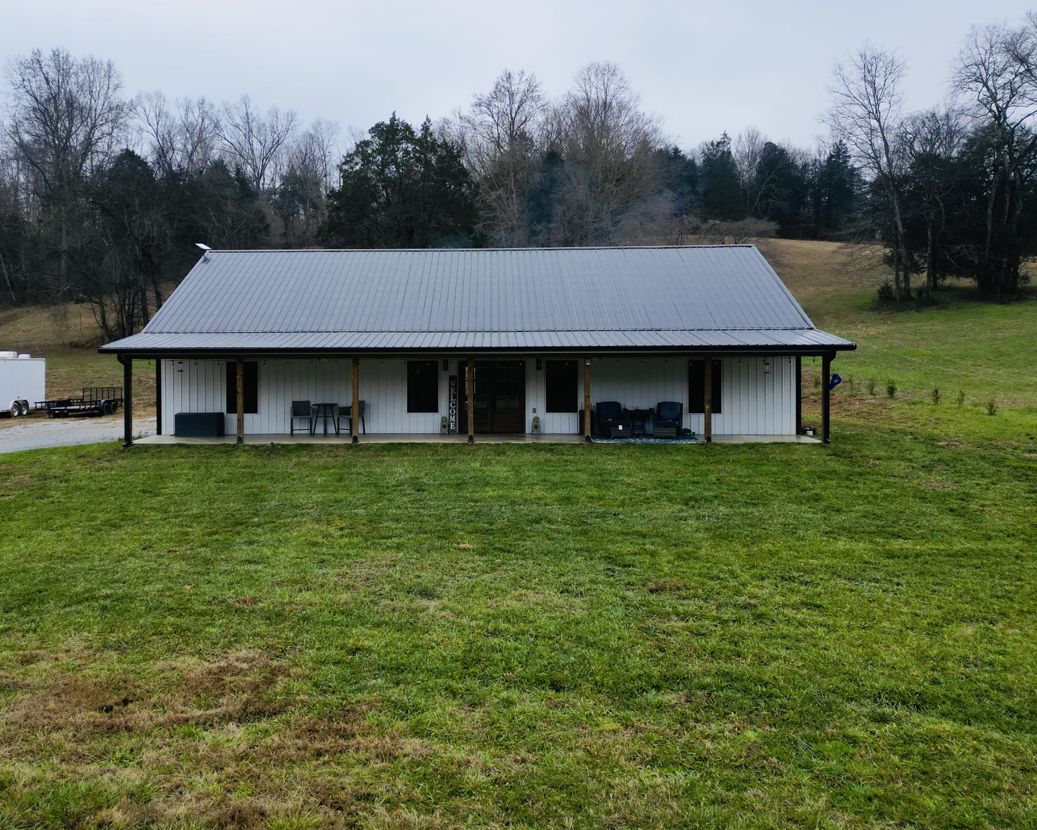 767 Potter Road Dickson, TN 37055 - Photo 1 of 30 a front view of a house with a garden