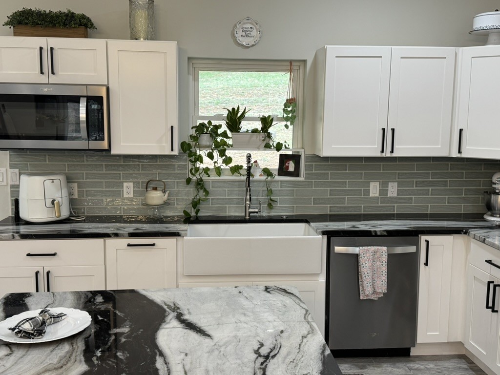 767 Potter Road Dickson, TN 37055 - Photo 11 of 30 a kitchen with a stove and a microwave