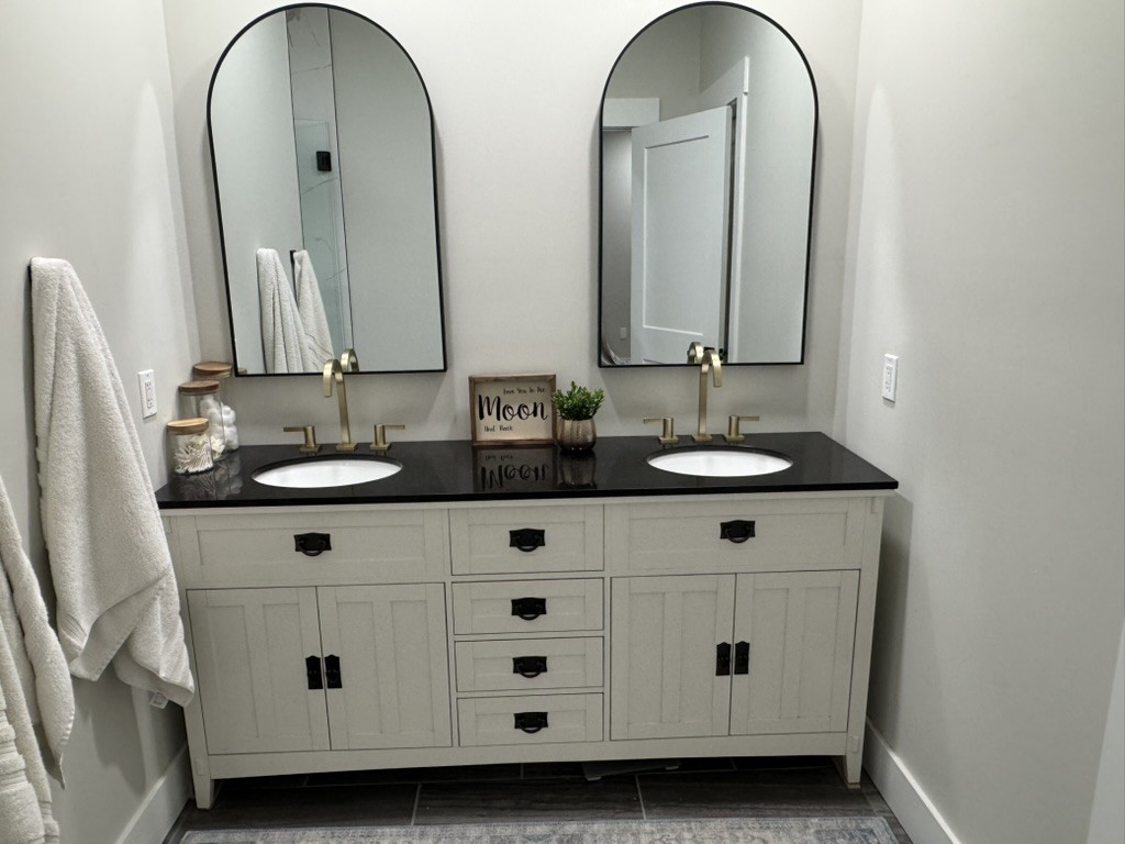 767 Potter Road Dickson, TN 37055 - Photo 16 of 30 a bathroom with double vanity sink and mirror