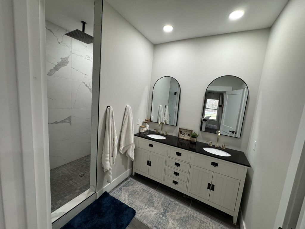 767 Potter Road Dickson, TN 37055 - Photo 17 of 30 a room with two mirror and a gate