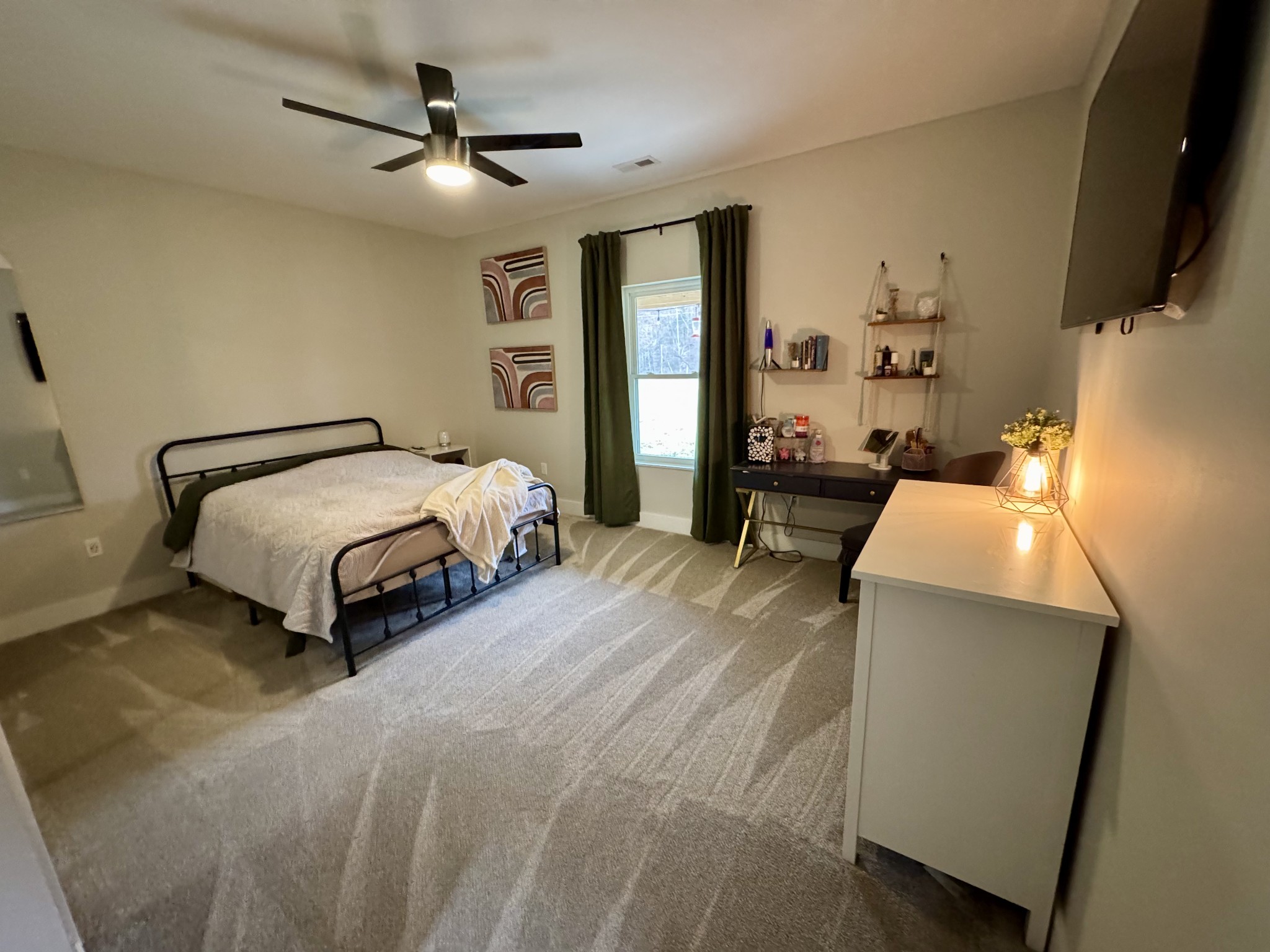 767 Potter Road Dickson, TN 37055 - Photo 19 of 30 a bedroom with a bed a window and flat screen tv