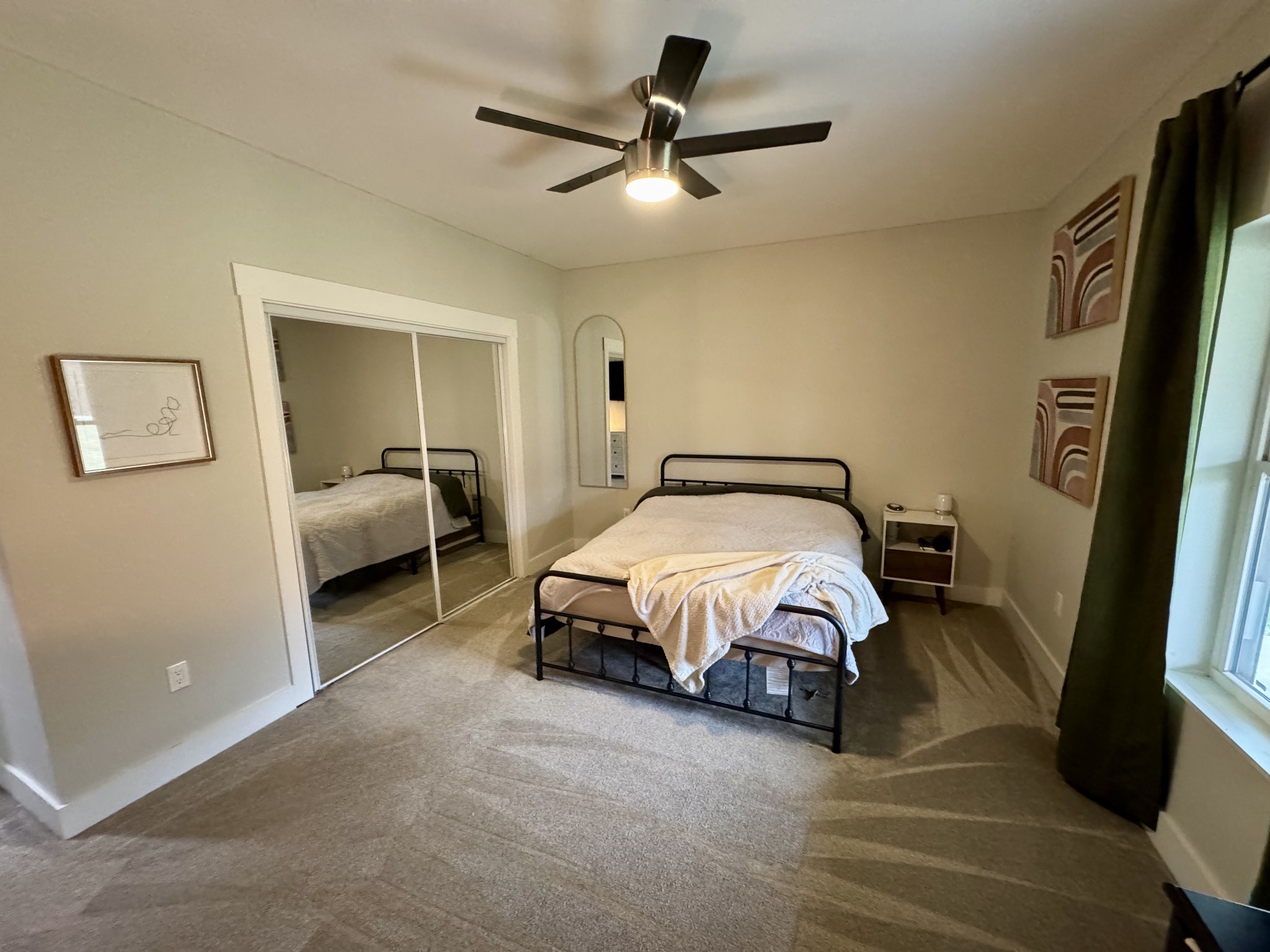 767 Potter Road Dickson, TN 37055 - Photo 20 of 30 a spacious bedroom with a bed and a walk in closet