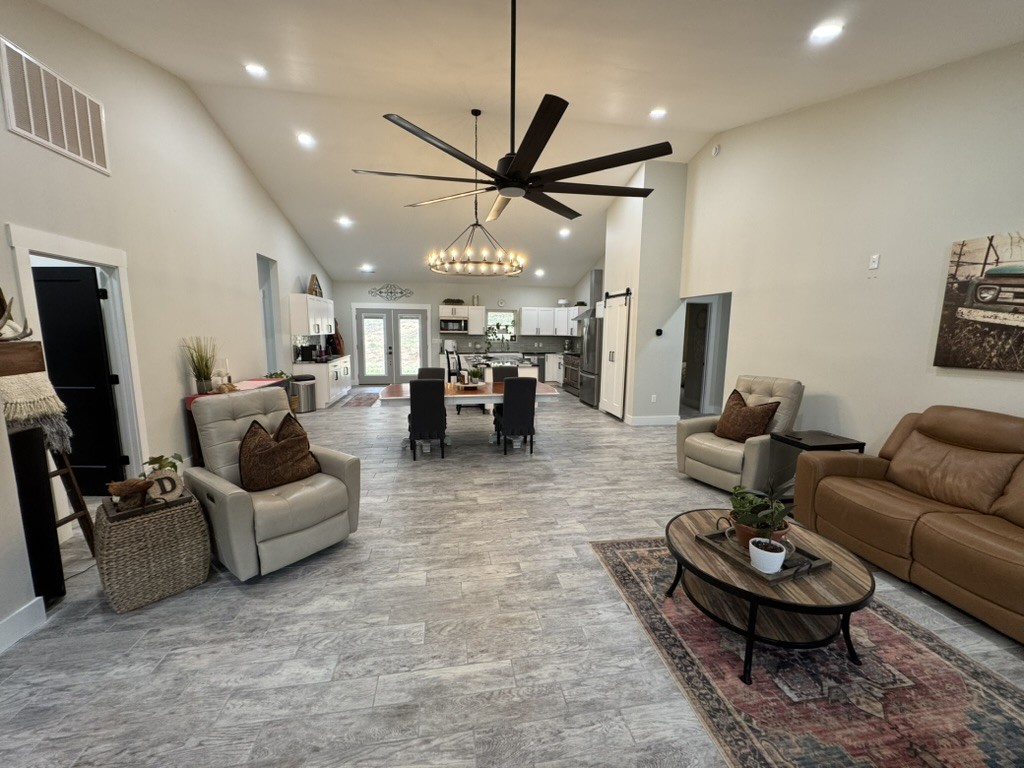 767 Potter Road Dickson, TN 37055 - Photo 2 of 30 a living room with furniture and a chandelier