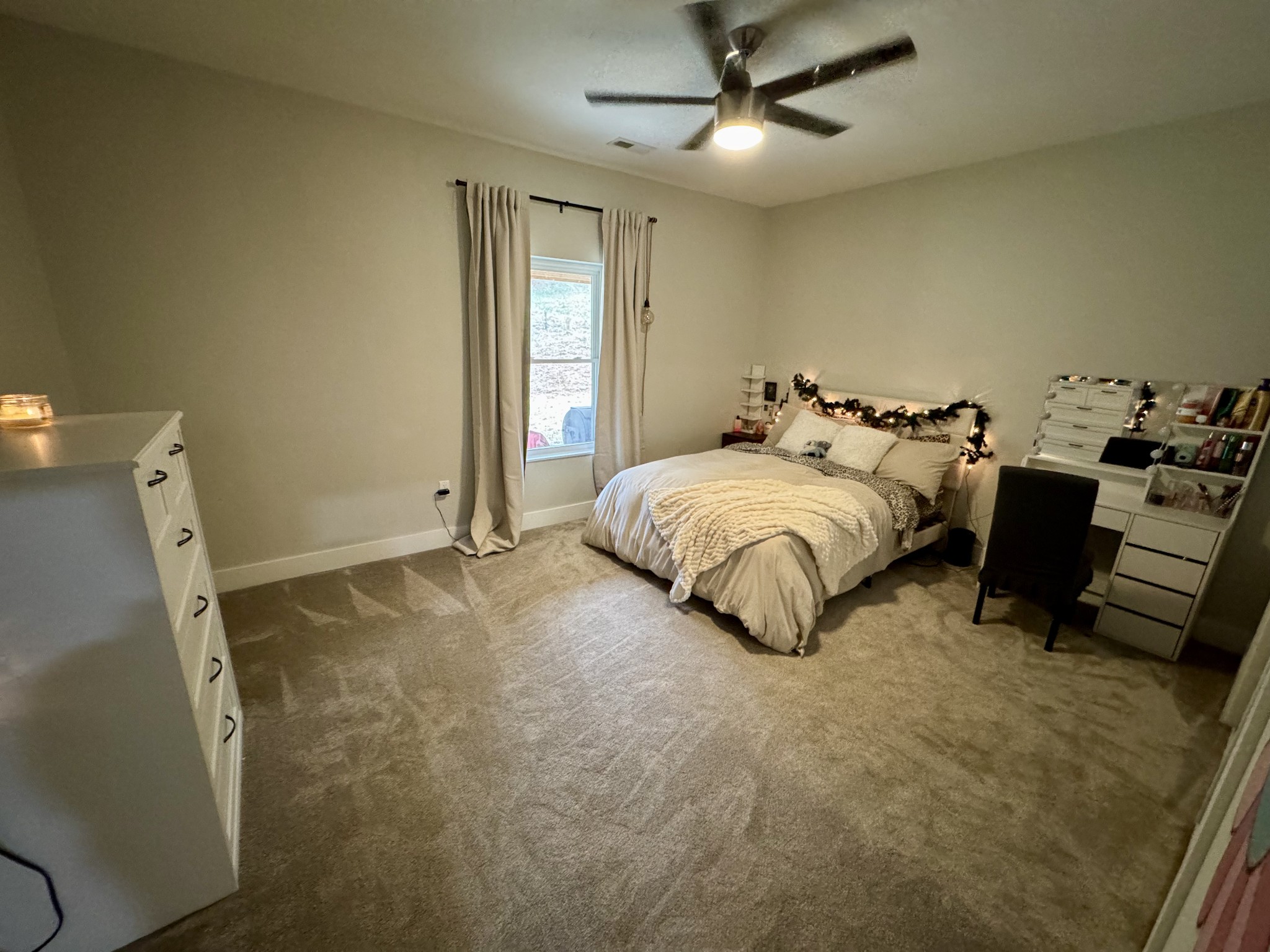 767 Potter Road Dickson, TN 37055 - Photo 21 of 30 a spacious bedroom with a bed and a dresser