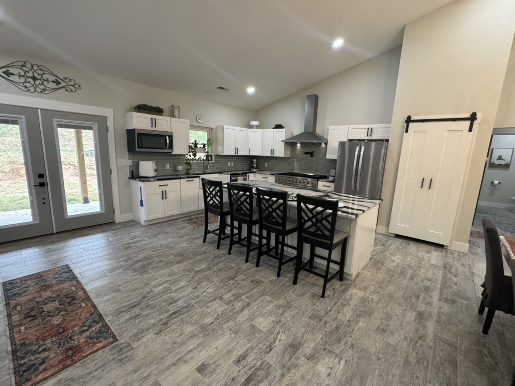 767 Potter Road Dickson, TN 37055 - Photo 7 of 30 a view of a dining room with furniture window and wooden floor