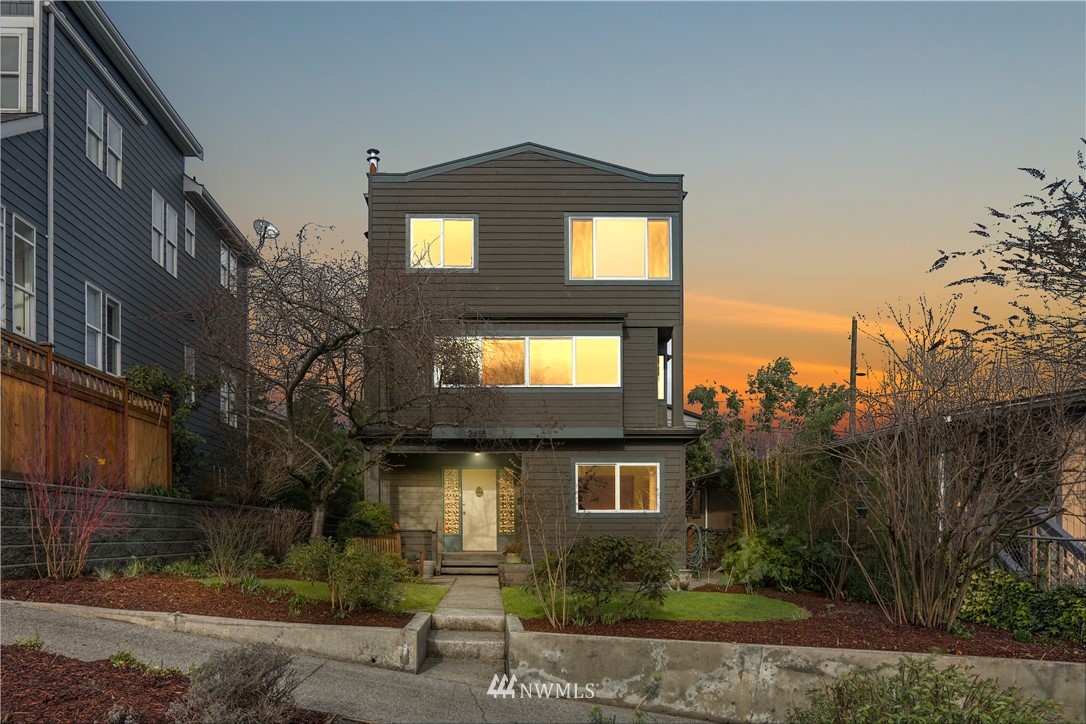 2418 East Roy Street Seattle, WA 98112 - Photo 1 of 32 a front view of a house with a yard