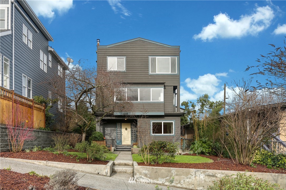 2418 East Roy Street Seattle, WA 98112 - Photo 2 of 32 a front view of a house with a yard