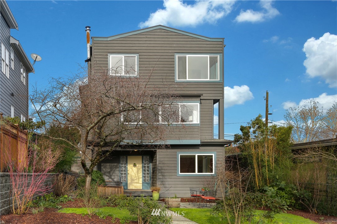 2418 East Roy Street Seattle, WA 98112 - Photo 3 of 32 a front view of a house with garden
