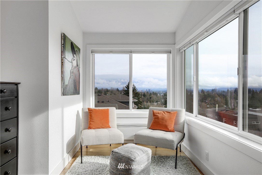 2418 East Roy Street Seattle, WA 98112 - Photo 25 of 32 a balcony with chairs and view of living room