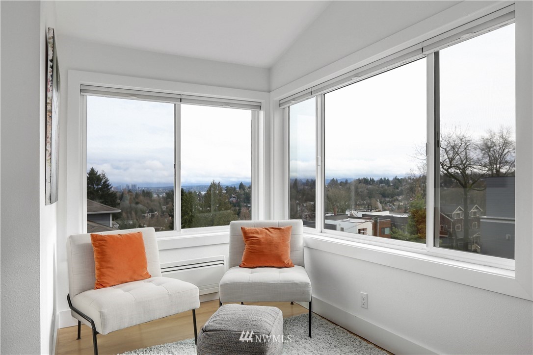 2418 East Roy Street Seattle, WA 98112 - Photo 26 of 32 a balcony with furniture and a large window