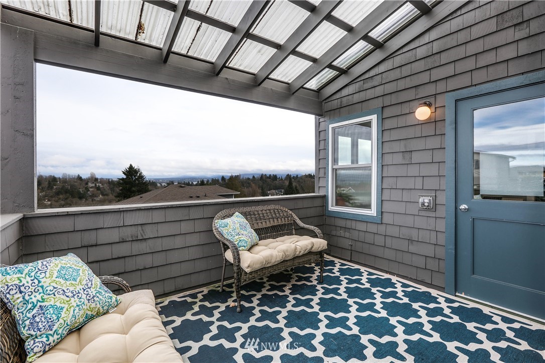 2418 East Roy Street Seattle, WA 98112 - Photo 29 of 32 a balcony with furniture