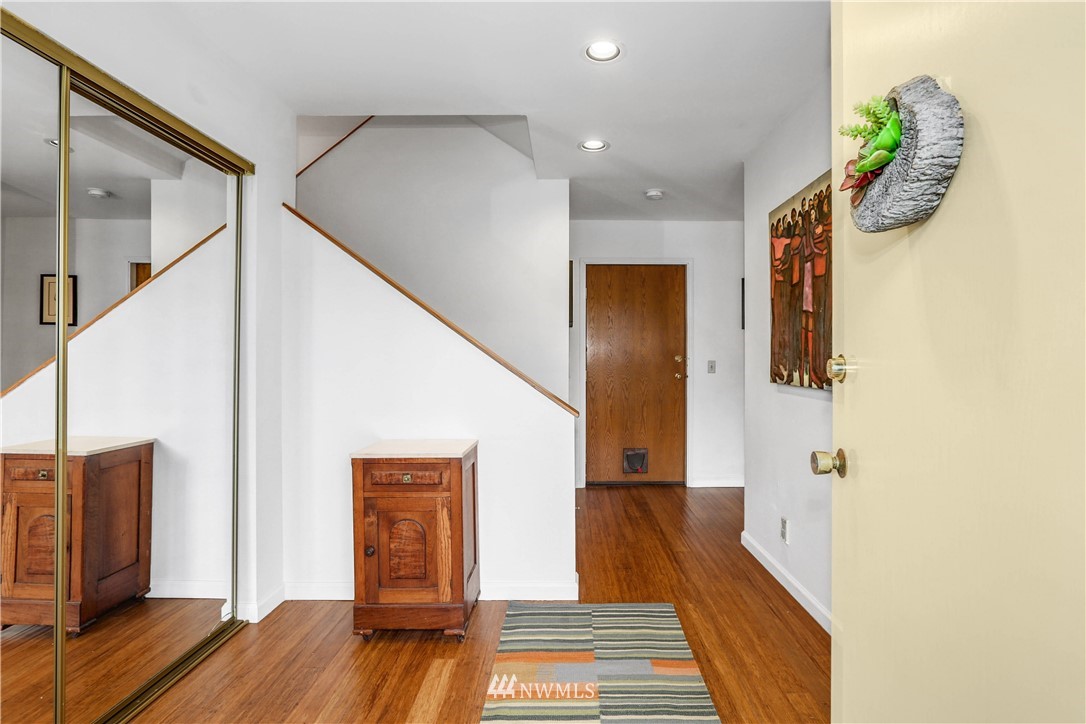 2418 East Roy Street Seattle, WA 98112 - Photo 6 of 32 a view of hallway with wooden floor