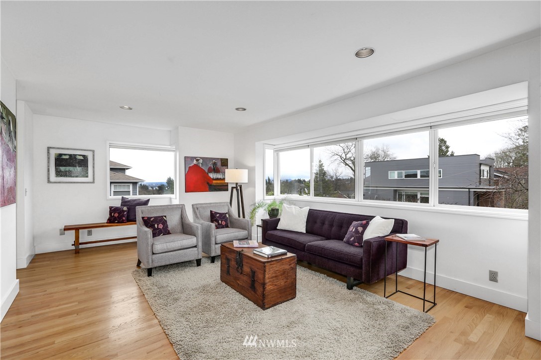 2418 East Roy Street Seattle, WA 98112 - Photo 7 of 32 a living room with furniture and a large window