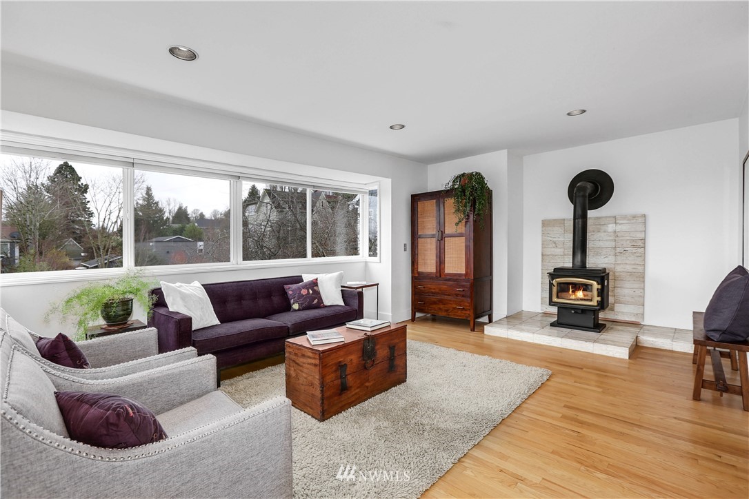 2418 East Roy Street Seattle, WA 98112 - Photo 8 of 32 a living room with furniture and a large window
