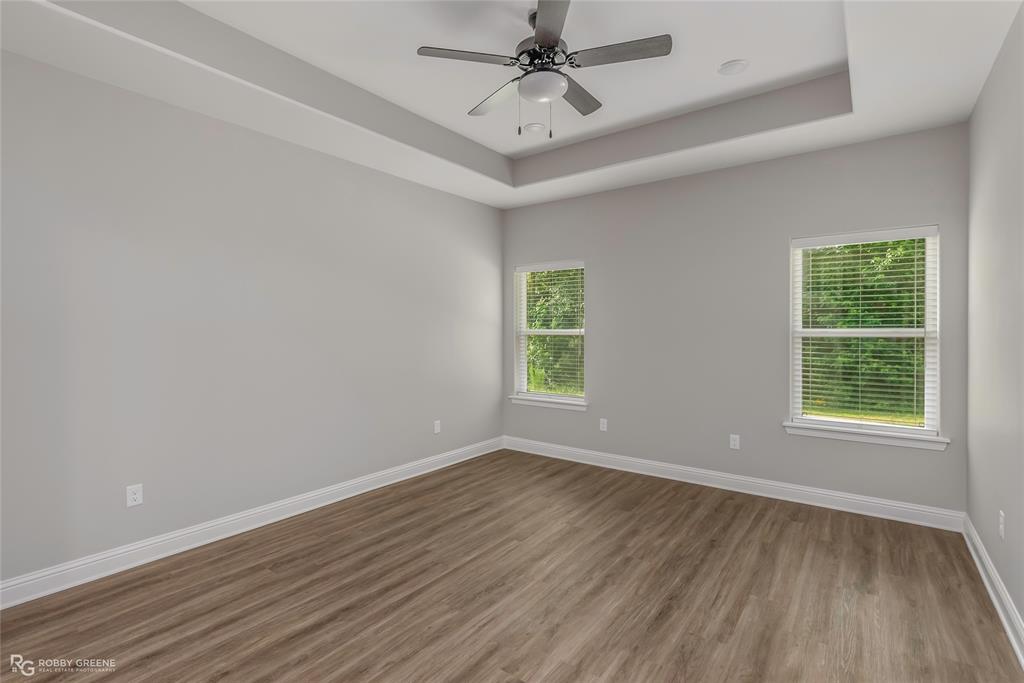 1013 VOSS Road Stonewall, LA 71078 - Photo 18 of 32 wooden floor in an empty room with a window