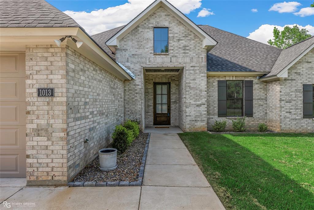 1013 VOSS Road Stonewall, LA 71078 - Photo 2 of 32 a front view of a house with garden