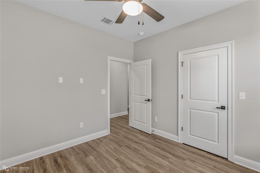 1013 VOSS Road Stonewall, LA 71078 - Photo 26 of 32 wooden floor in an empty room with a window