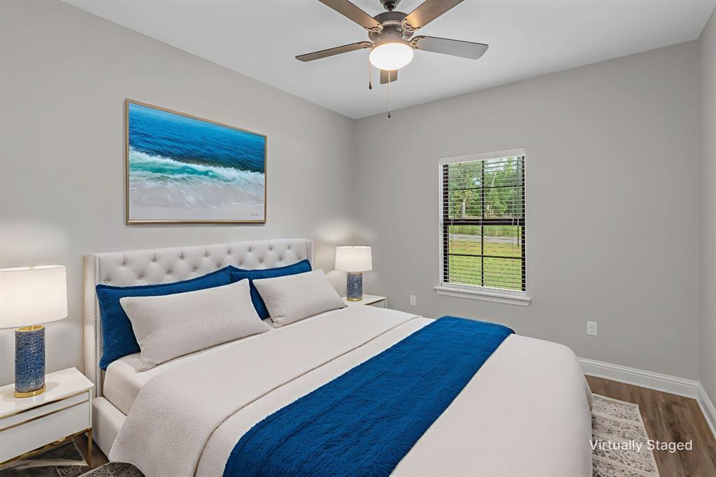 1013 VOSS Road Stonewall, LA 71078 - Photo 27 of 32 a bedroom with a bed and a painting on the wall