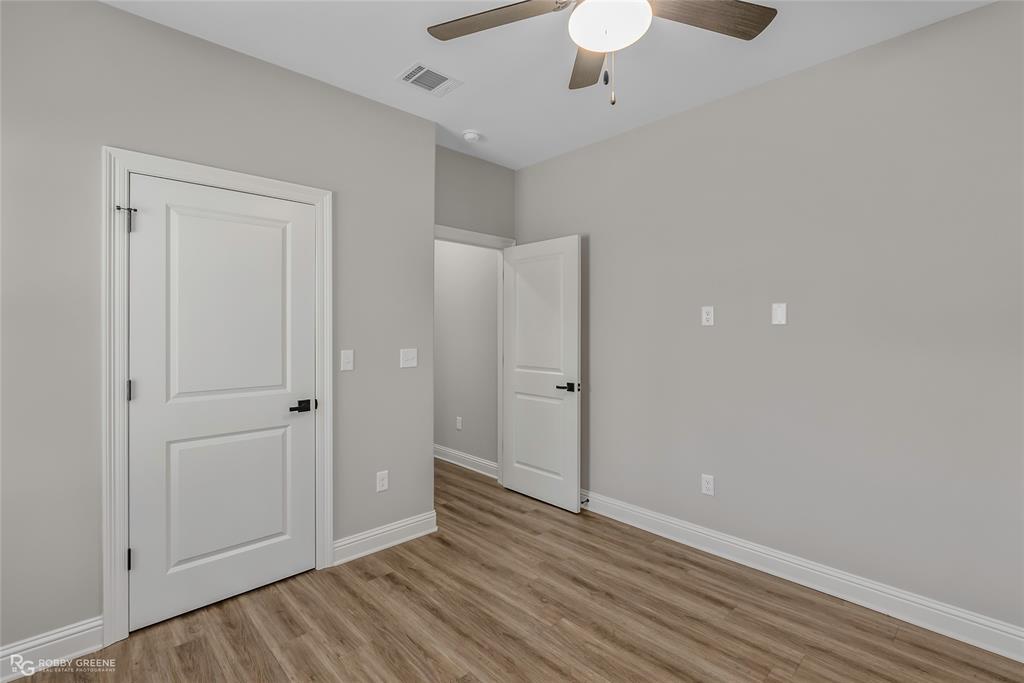 1013 VOSS Road Stonewall, LA 71078 - Photo 31 of 32 a view of an empty room with wooden floor