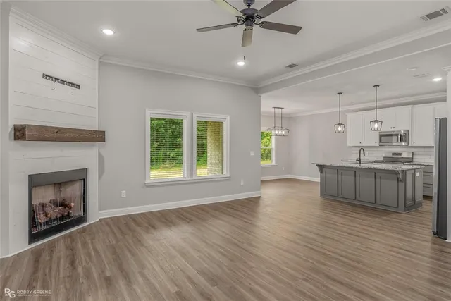 a view of kitchen with furniture and fireplace