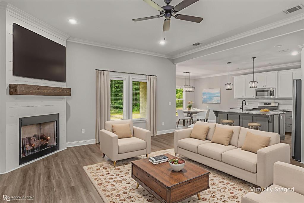 1013 VOSS Road Stonewall, LA 71078 - Photo 8 of 32 a living room with furniture and a fireplace