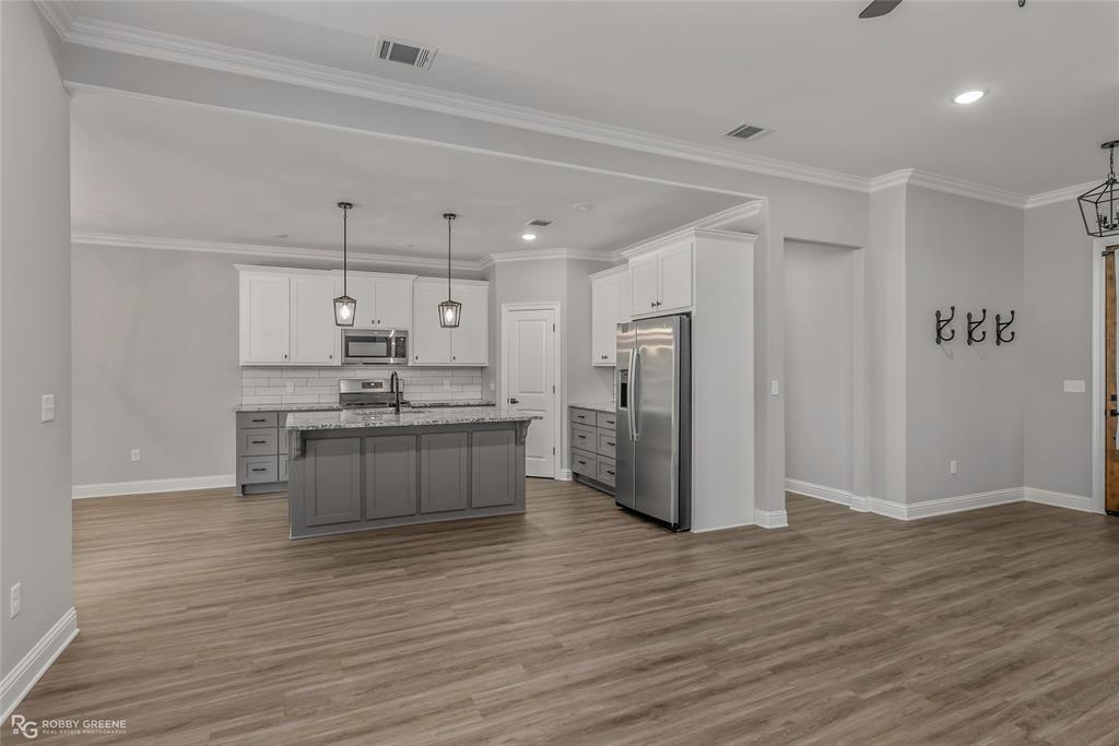 1013 VOSS Road Stonewall, LA 71078 - Photo 10 of 32 a kitchen with stainless steel appliances a refrigerator and a stove top oven