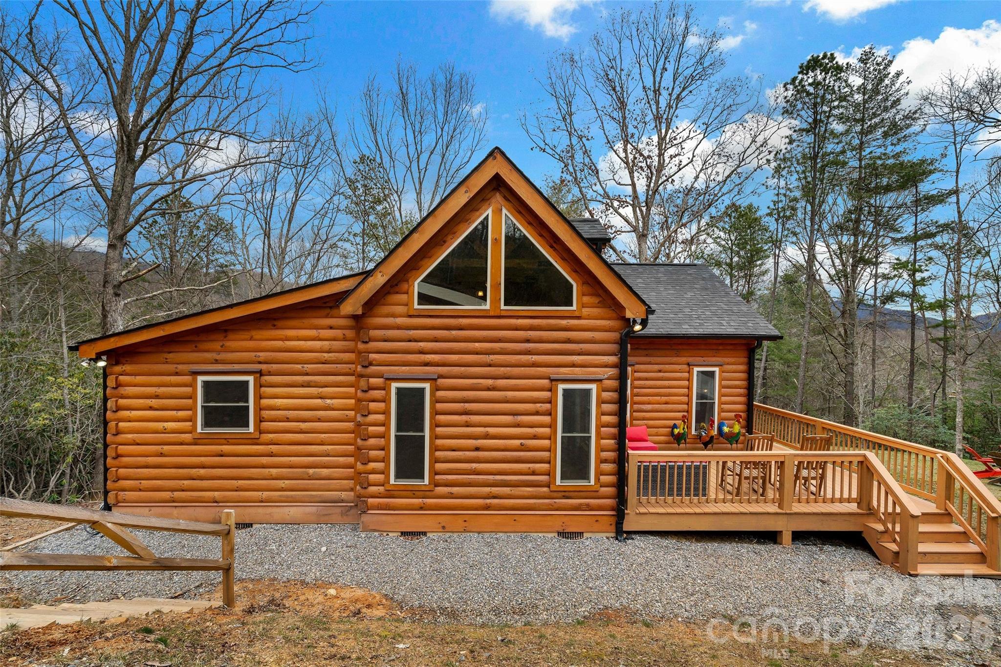 67-69 Flat Top Mountain Road Fairview, NC 28730 - Photo 11 of 43 a front view of a house with garden