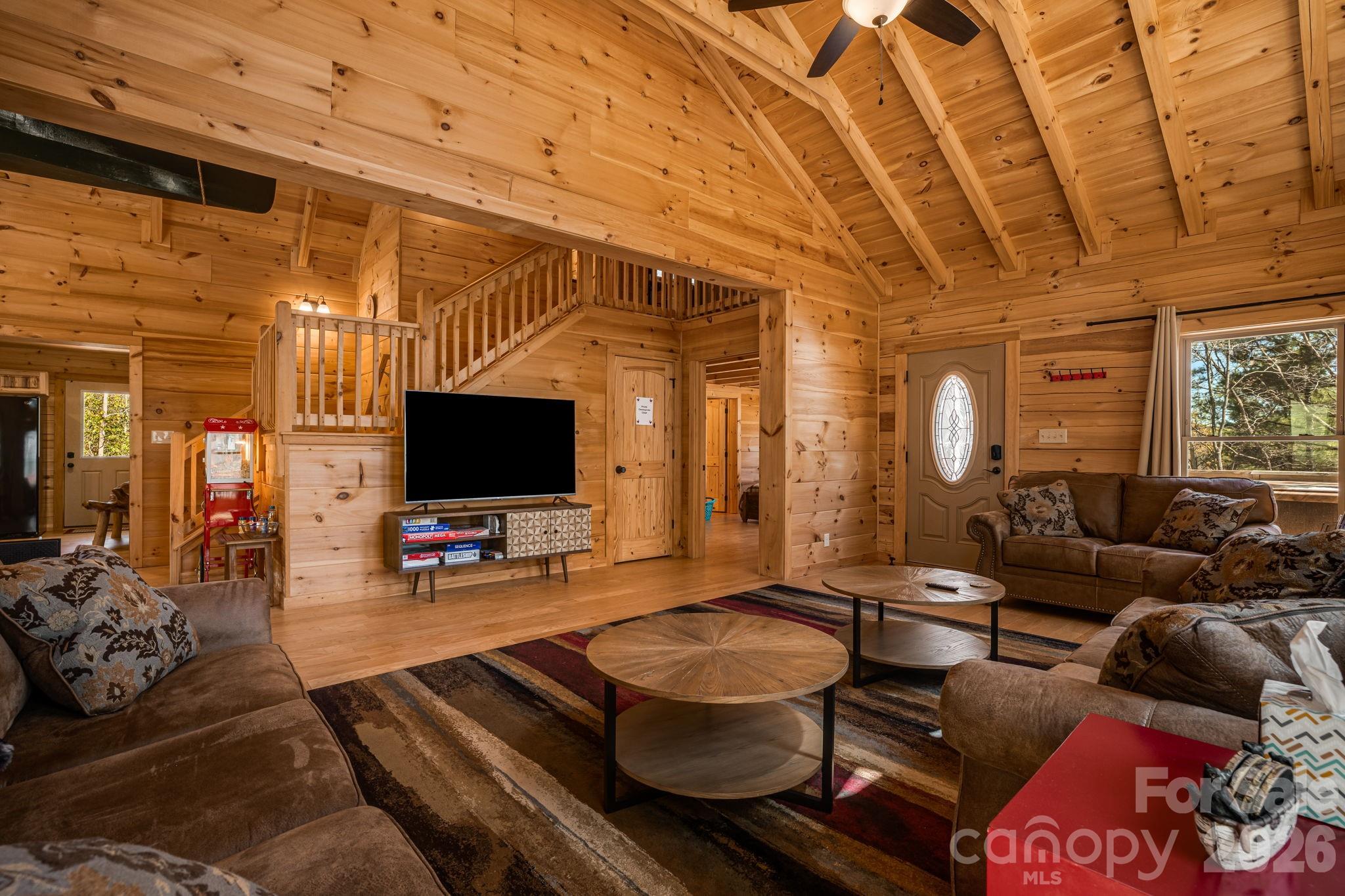 67-69 Flat Top Mountain Road Fairview, NC 28730 - Photo 14 of 43 a living room with furniture and a flat screen tv