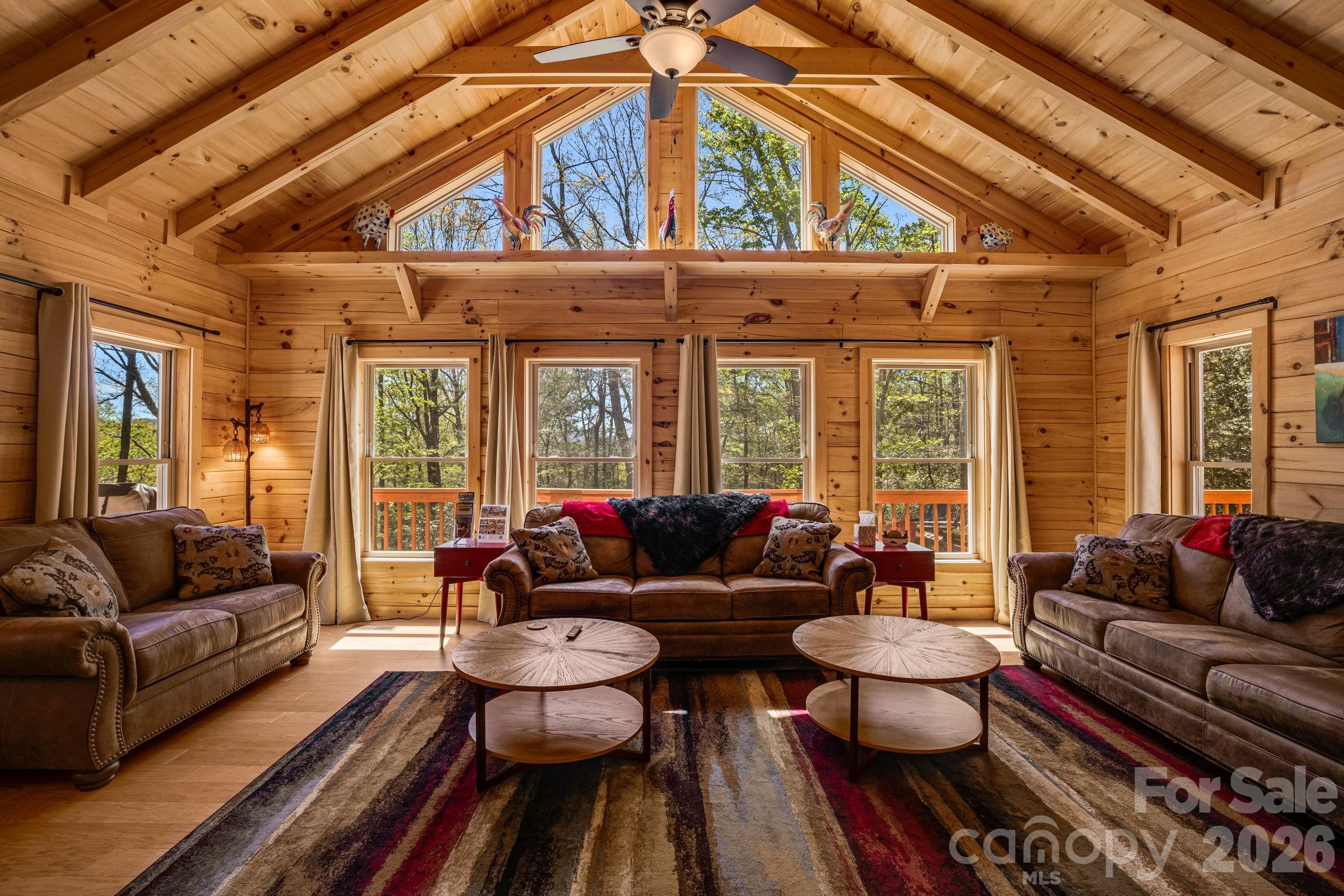67-69 Flat Top Mountain Road Fairview, NC 28730 - Photo 16 of 43 a living room with furniture and a large window