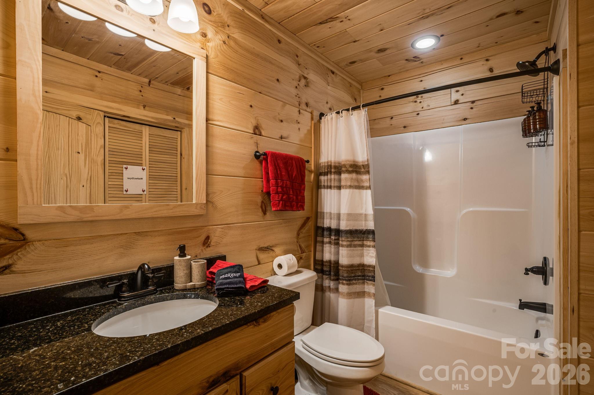 67-69 Flat Top Mountain Road Fairview, NC 28730 - Photo 22 of 43 a bathroom with a granite countertop sink toilet and shower