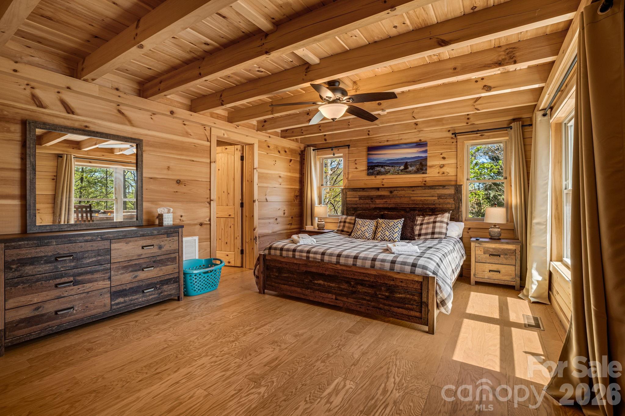 67-69 Flat Top Mountain Road Fairview, NC 28730 - Photo 24 of 43 a bedroom with furniture and a window