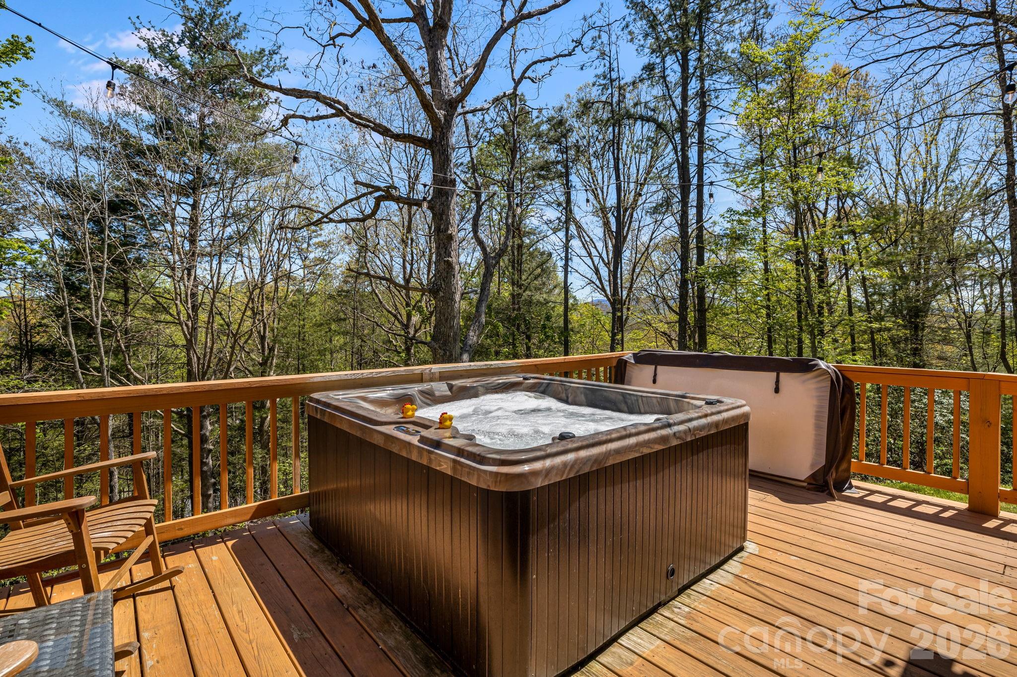 67-69 Flat Top Mountain Road Fairview, NC 28730 - Photo 29 of 43 a view of a balcony with wooden floor and fence