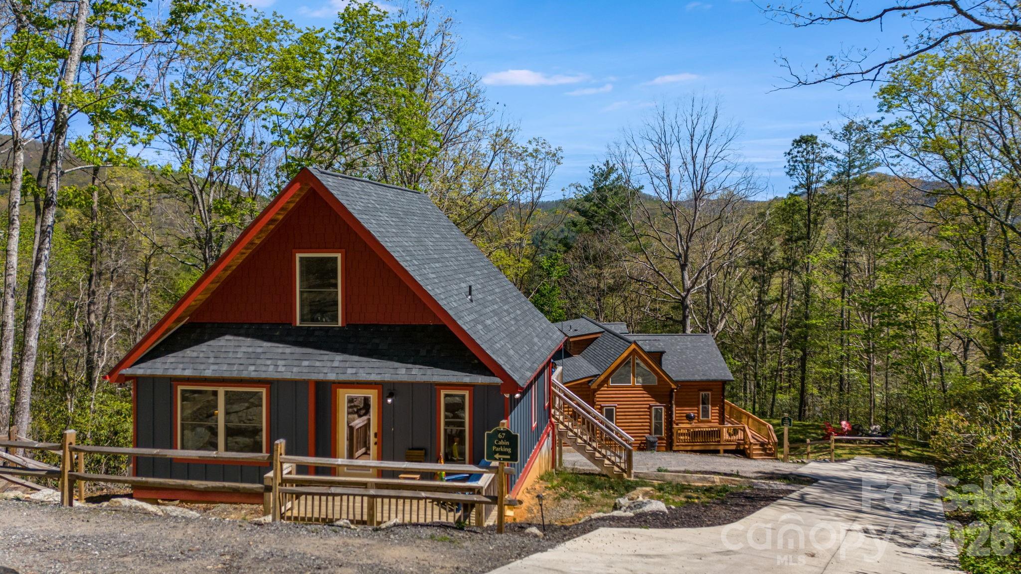 67-69 Flat Top Mountain Road Fairview, NC 28730 - Photo 3 of 43 a front view of a house with a tree