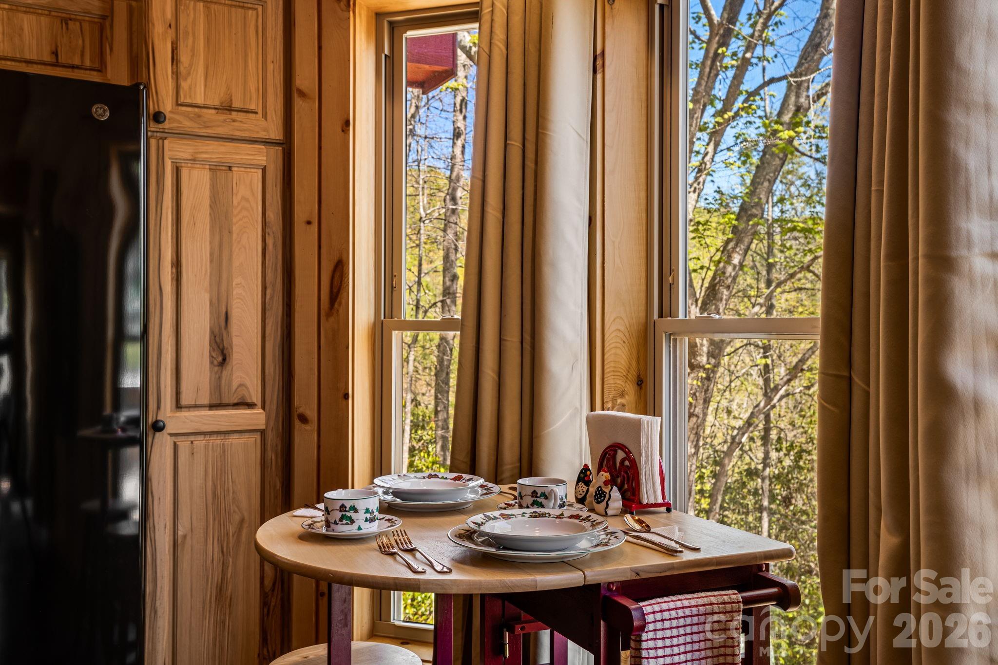 67-69 Flat Top Mountain Road Fairview, NC 28730 - Photo 36 of 43 a view of a dining room with furniture window and outside view