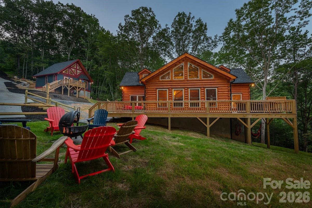 67-69 Flat Top Mountain Road Fairview, NC 28730 - Photo 4 of 43 a view of a house with a backyard