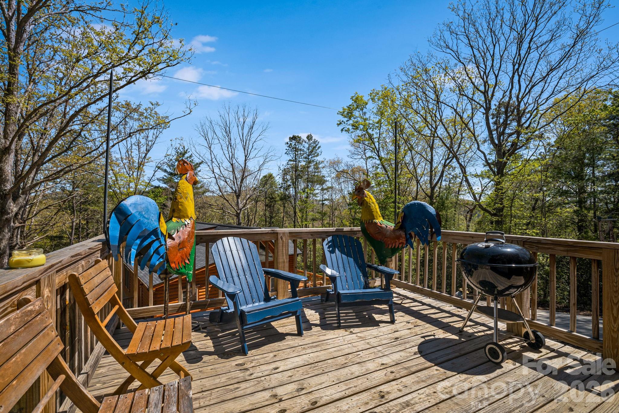 67-69 Flat Top Mountain Road Fairview, NC 28730 - Photo 42 of 43 a view of deck with table and chairs and wooden floor