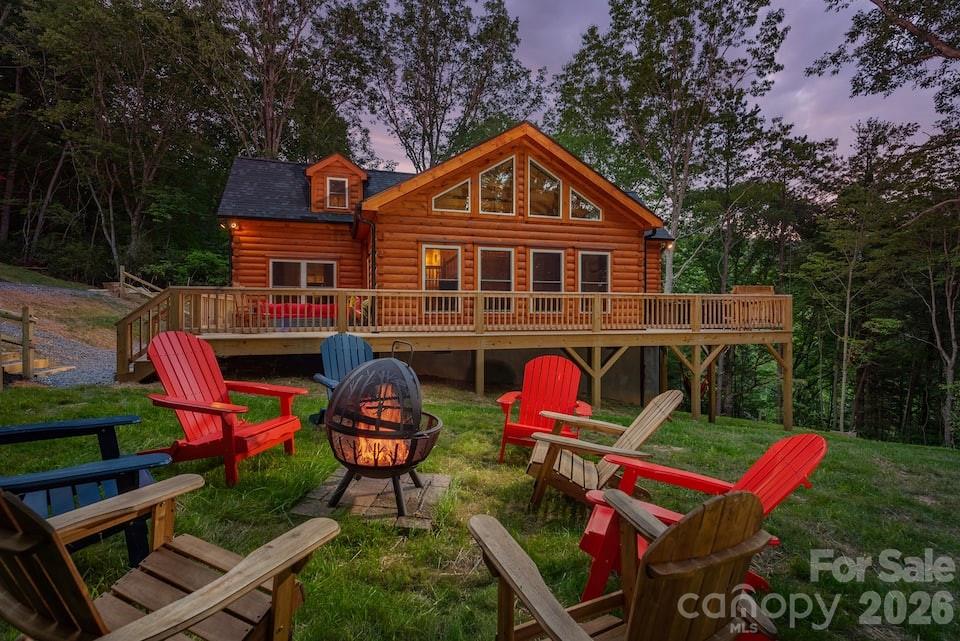 67-69 Flat Top Mountain Road Fairview, NC 28730 - Photo 5 of 43 a front view of a house with patio