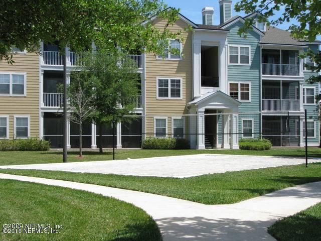 8550 Touchton Road, Unit 636 Jacksonville, FL 32216 - Photo 2 of 11 a front view of a house with a yard